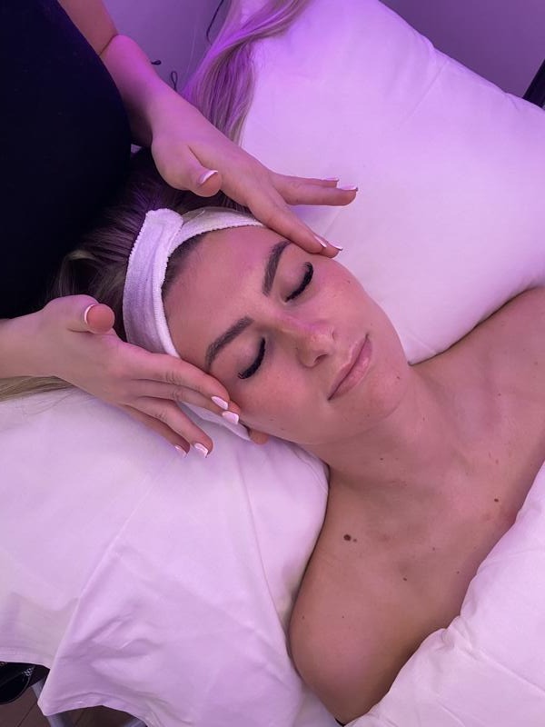 A relaxing facial in progress in the treatment room